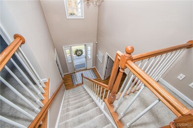 The soaring 2-story foyer graciously welcomes you