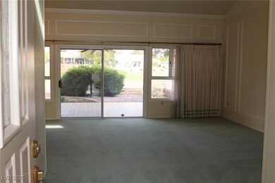 Entryway featuring carpet, a decorative wall, and