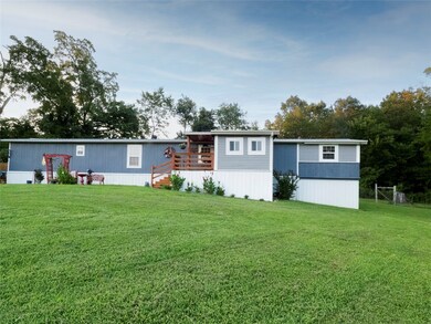 Inviting front lawn with porch and foyer.