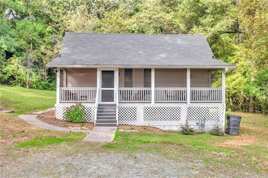 Bungalow with a porch and a front yard