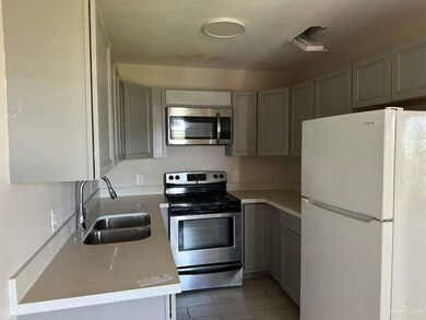 Unfurnished dining area featuring baseboards and wood tiled floors