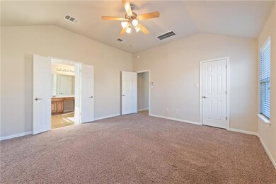 Unfurnished bedroom featuring vaulted ceiling, li