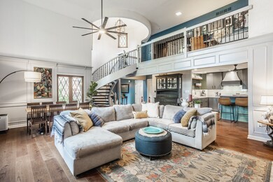 Enter the home into this amazing Great Room with soaring ceilings. The room has incredible natural light and unique spiral staircase.