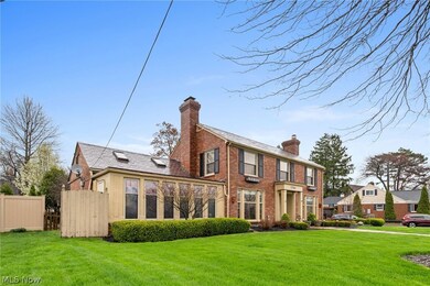 Rear view of house featuring a yard