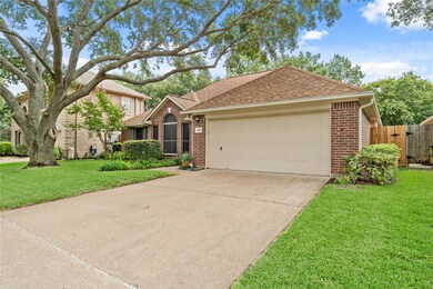Double wide driveway with 2 car garage