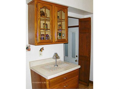 Kitchen. Side door to small deck on side of home.