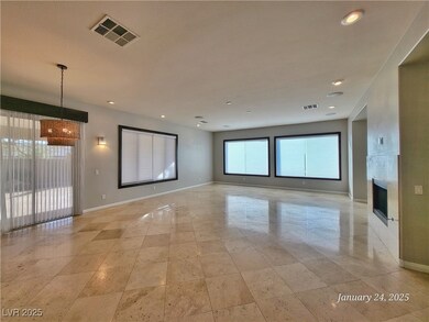 Empty room featuring baseboards, visible vents, an