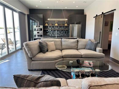 Living area with finished concrete floors, recesse