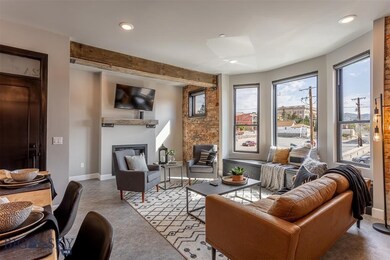 Living room featuring beamed ceiling