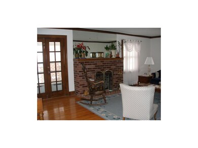 French doors lead to the porch just off the living