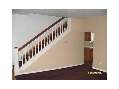 Living Room. Look at the pretty original bannister