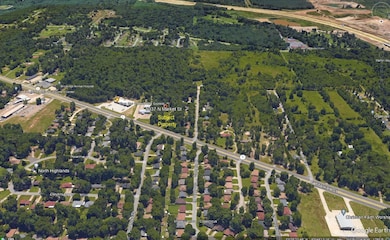 Birds eye view of property featuring a view of tre