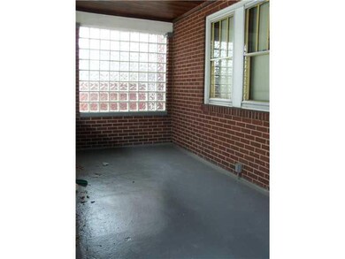 Exterior Front. The large covered front porch is a