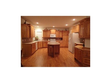KITCHEN WITH CORNER SINK, ISLAND, PANTRY, DESK, AN