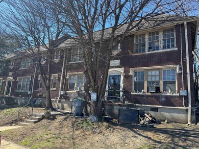 View of front of home featuring brick siding