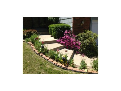 Newer concrete steps with flowers in bloom!