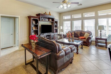 Family area with wall of windows leading out to the patio makes it light and bright.