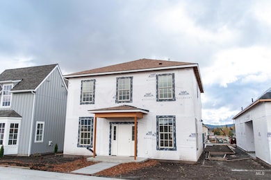 View of front facade featuring a shingled roof
