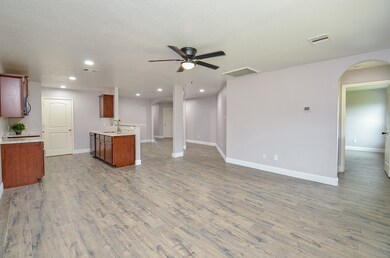 Living room with view of kitchen and dining room