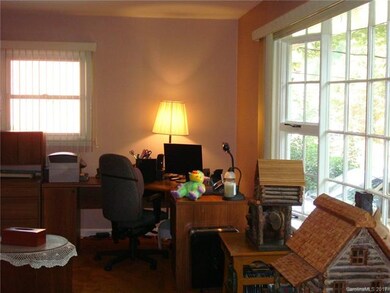 Living Room has large bay window and a brick firep