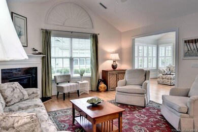 Open concept living with high ceilings, big window