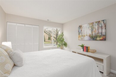 Bedroom with carpet and a closet