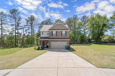 Craftsman inspired home with a garage, brick sidin