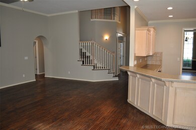 Family room view looking toward the stairs and ent