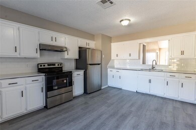 Kitchen with appliances with stainless steel finis