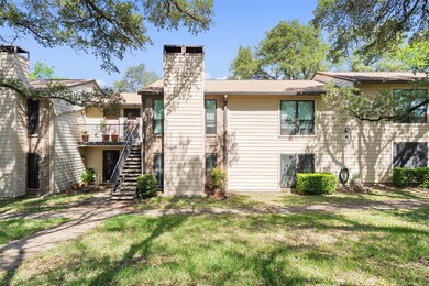 Rear view of property featuring stairway, a chimn