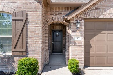 Entrance to property featuring a garage