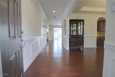 FOYER: The inviting foyer entry offers a wide hall