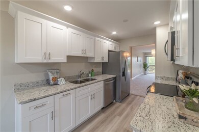 Kitchen with solid wood shaker style cabinetry, wi