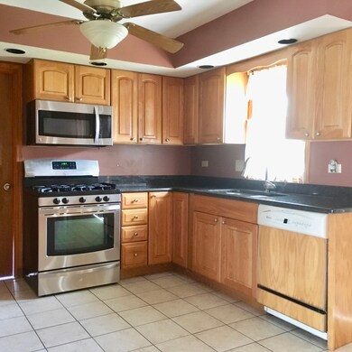 Newer stainless steel appliances with granite coun