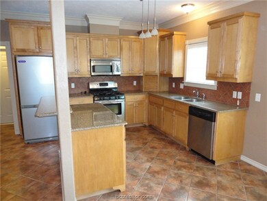 Kitchen with granite countertops, backsplash, 5 bu