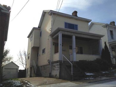 Exterior Front. One car detached garage with drive