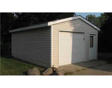 Parking Lot/Garage. Garage with vinyl siding measu