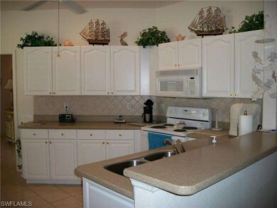 New cabinet doors and tile backsplash..