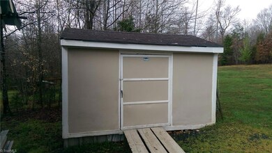 Small building with power and water (utility sink). Previously used for processing meat.