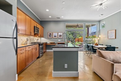 Kitchen with stainless steel appliances, dark cou