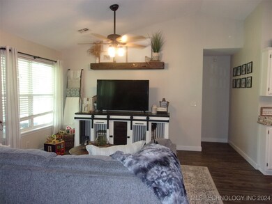 LIVING AREA WITH VIEW OF HALLWAY TO MAIN BEDROOM