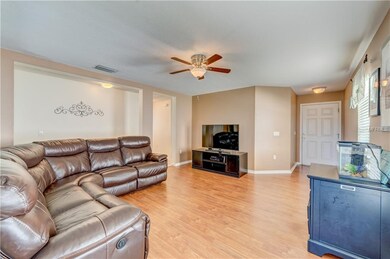 Living room looking at foyer and front door.