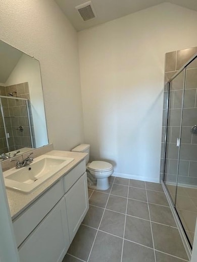 Full bathroom with vanity, a stall shower, tile p