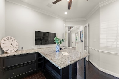 French Doors Open to a Spacious Foyer and Spiral S