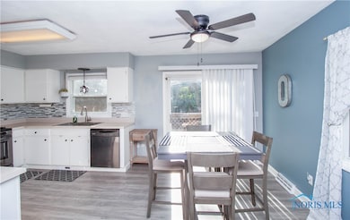Open to the eat in kitchen with sliding door.