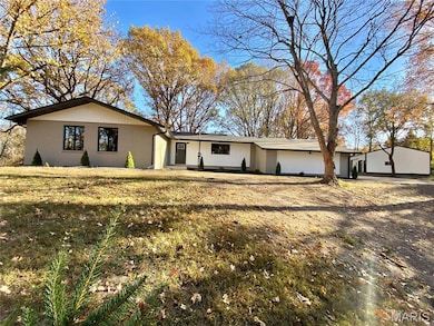 View of front of home featuring brick siding and a front lawn
