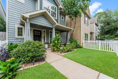 White picket fencing surrounds the entire property