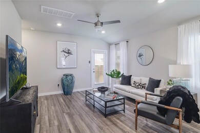 Living room with wood finished floors, a ceiling 