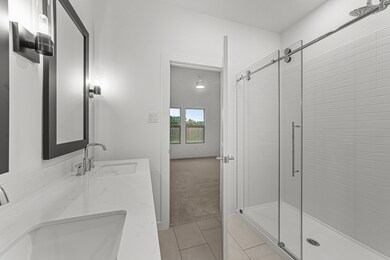 Primary bath with glass shower enclosure