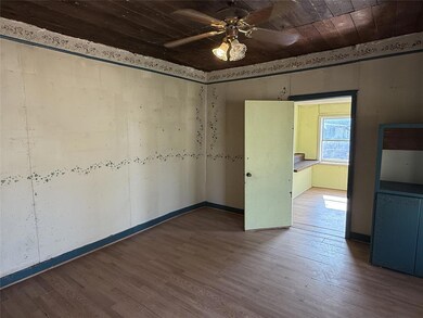 Unfurnished room with wood ceiling, wood-type floo